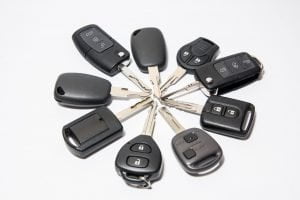 Car locksmith keys from various manufacturers aligned in star shape