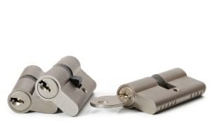 Residential locksmith three lock cylinders with a key