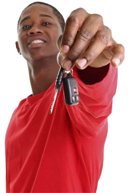 Young man holding car keys from Mobile Locksmith